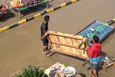 Shifting Items from flooded Khatima toll plaza